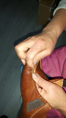 Hand-stitching the apron on Suzi