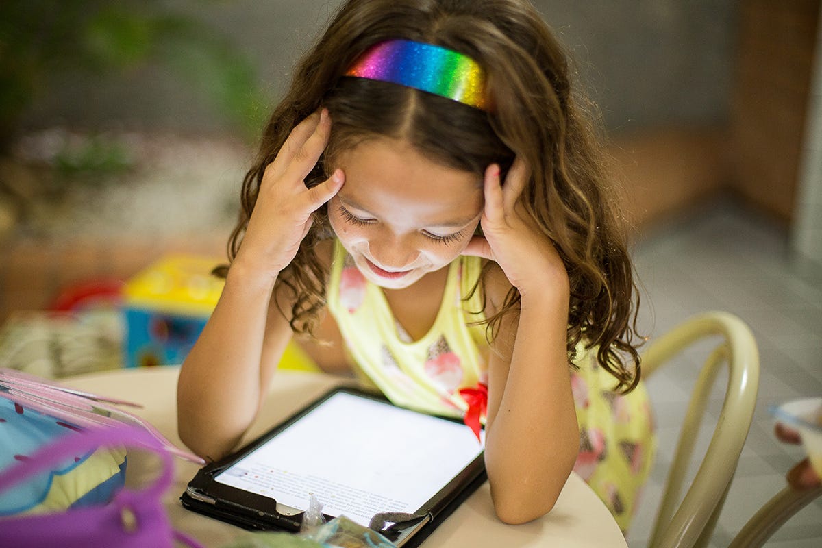 A child playing on her iPad