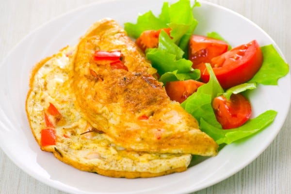 Herb omelette with fried tomatoes