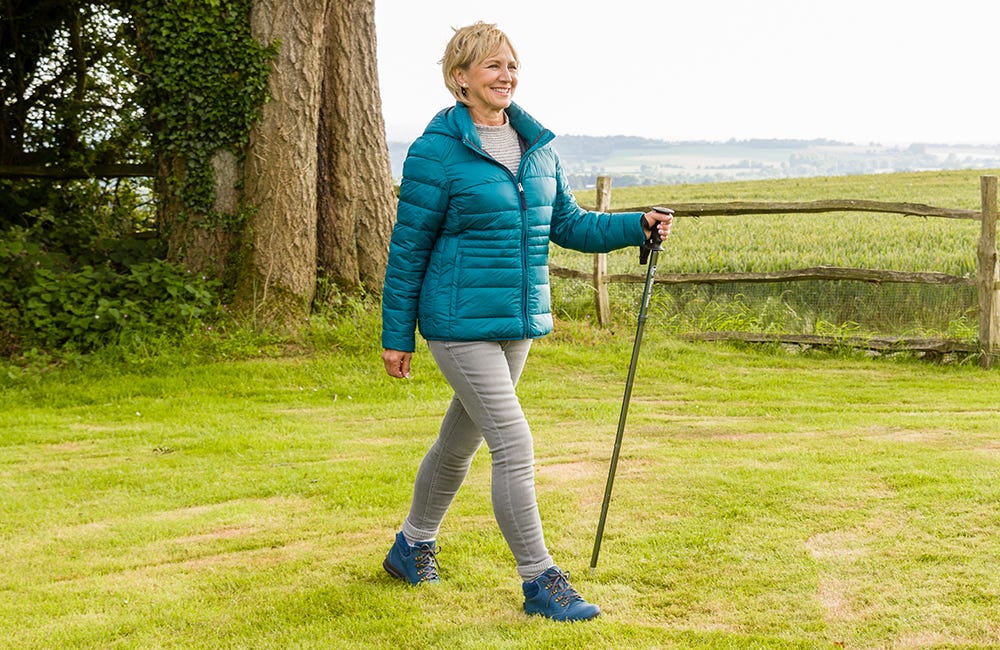 Woman walking with a Folding Hiking Pole