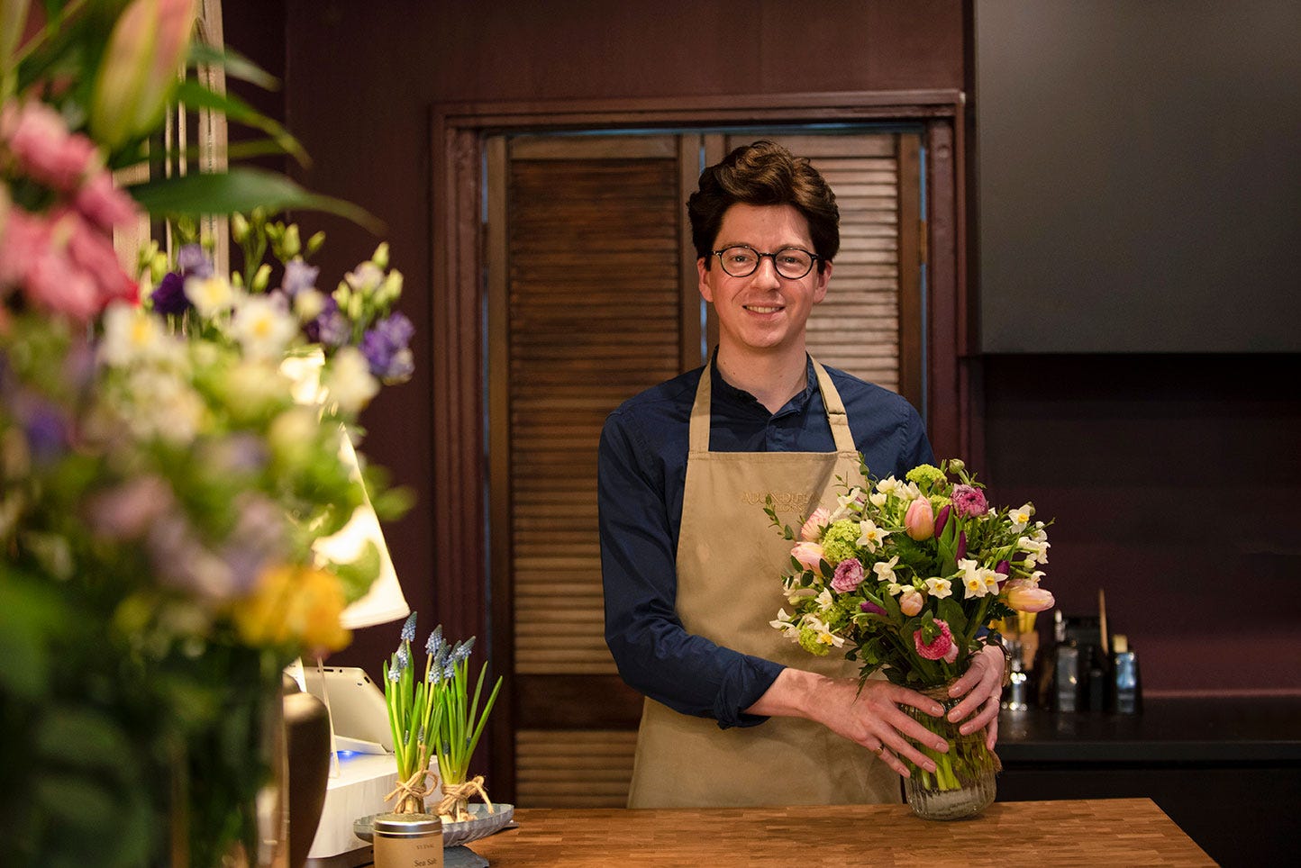 Florist Jake holding spring bouquet