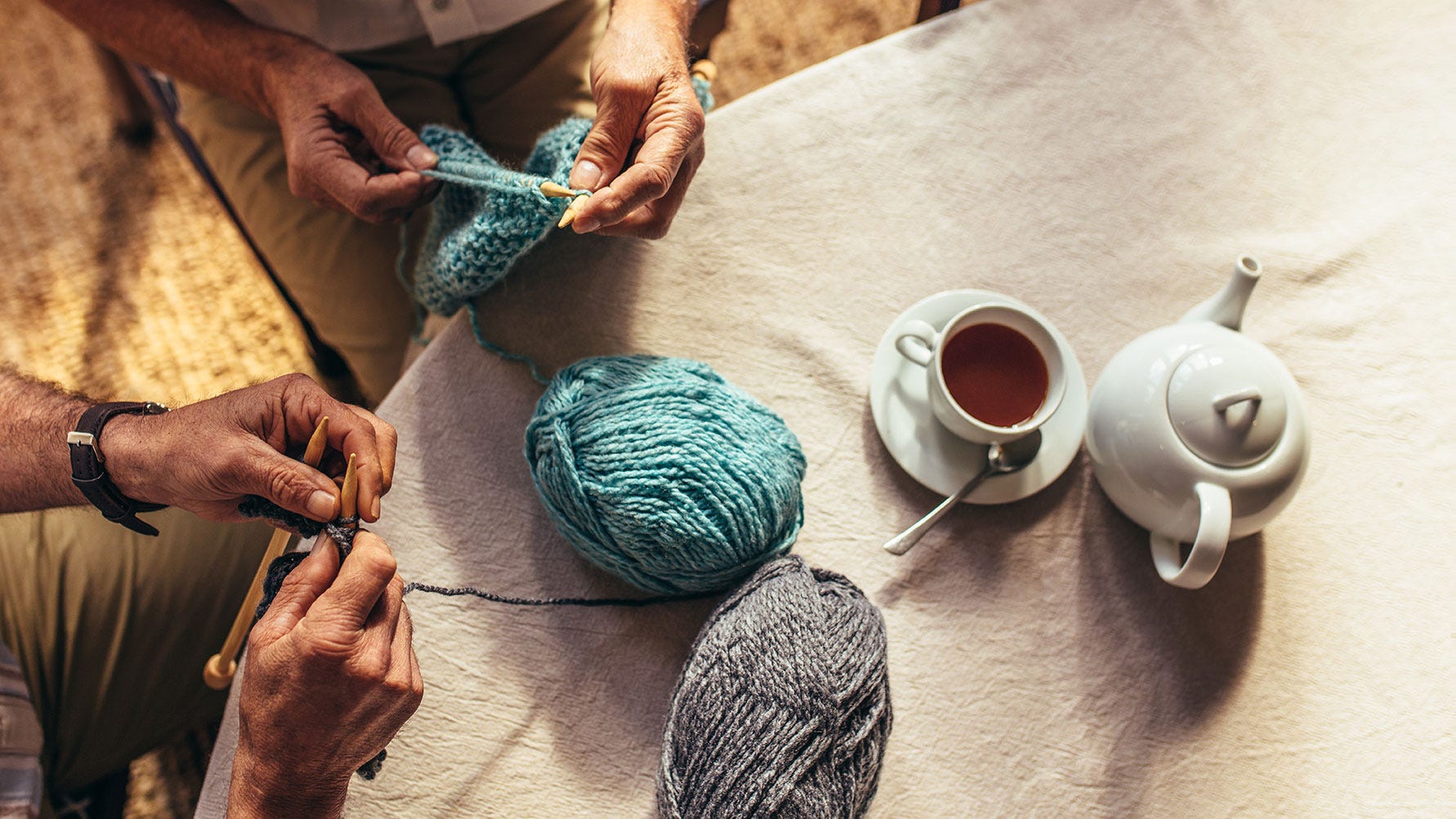 Senior people knitting