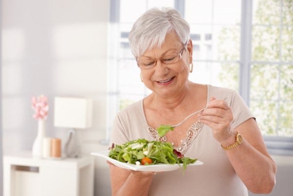 Lady eating salad