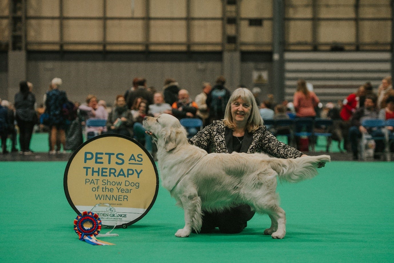 Sue Riley with her golden retriever Carson